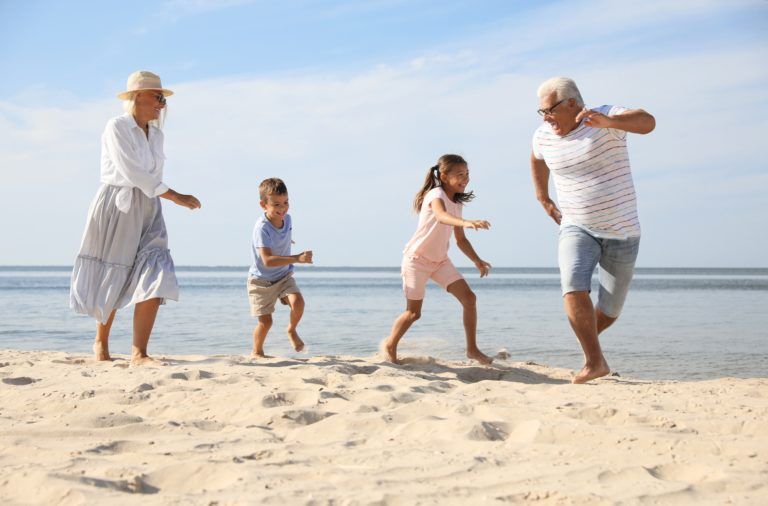 Cute,Little,Children,With,Grandparents,Spending,Time,Together,On,Sea