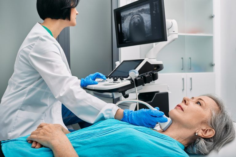 Ultrasound,Diagnostics,Of,Thyroid,Gland.,Endocrinologist,Making,Ultrasonography,To,Senior